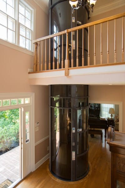 a pneumatic vacuum elevator leading up to the second floor of a home