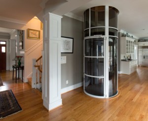 PVE 52″ white pneumatic vacuum elevator installed in a living area.