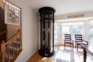 Cylindrical home elevator in a living space in North Bethesda, MD.