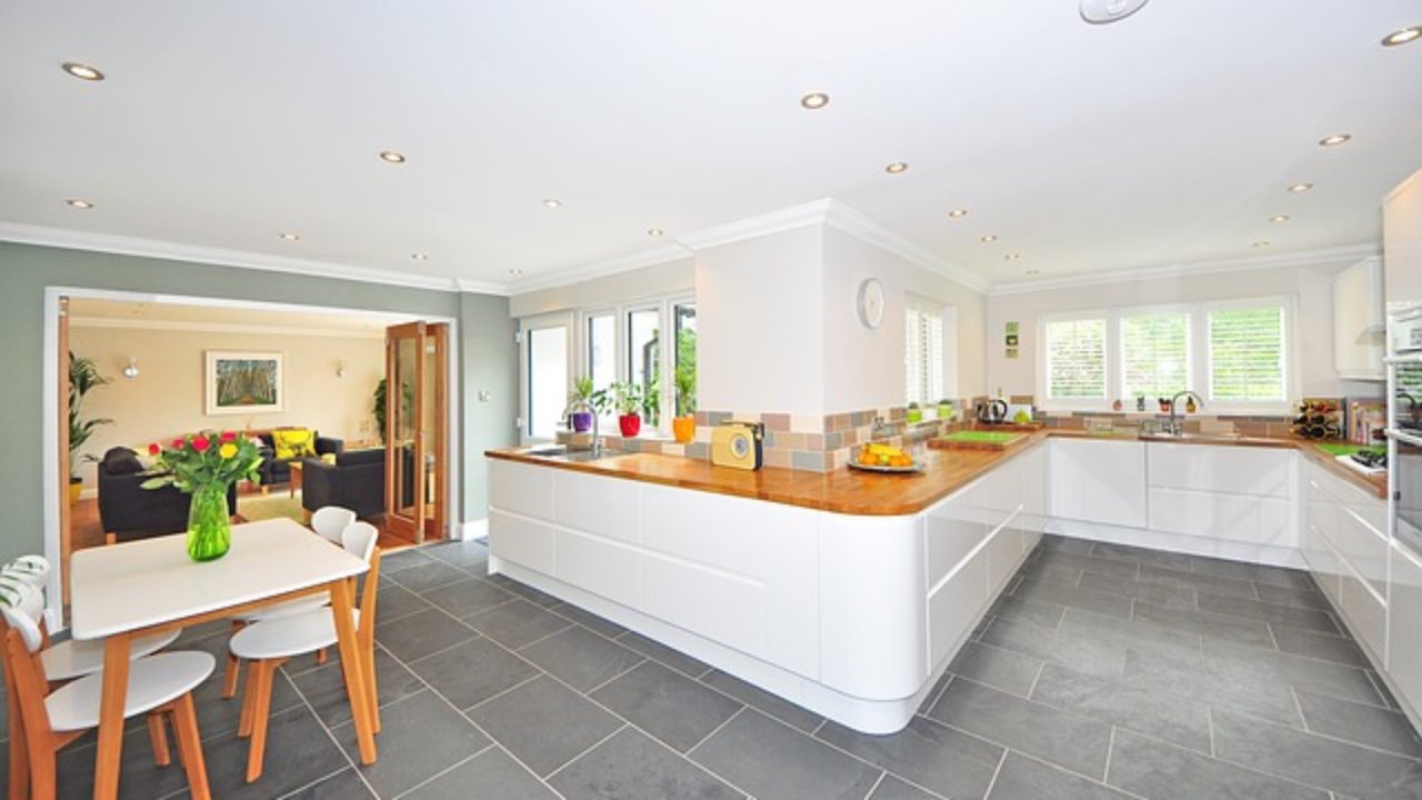 a kitchen with a table and chairs in it
