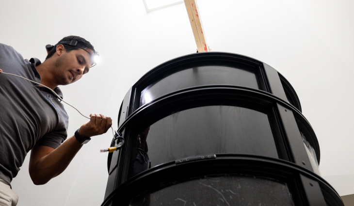 Tech installing home elevator