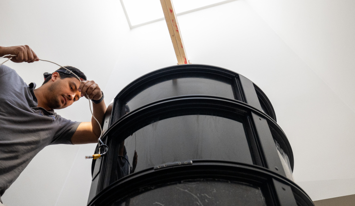 Technician installing home elevator